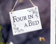 FOUR IN A BED